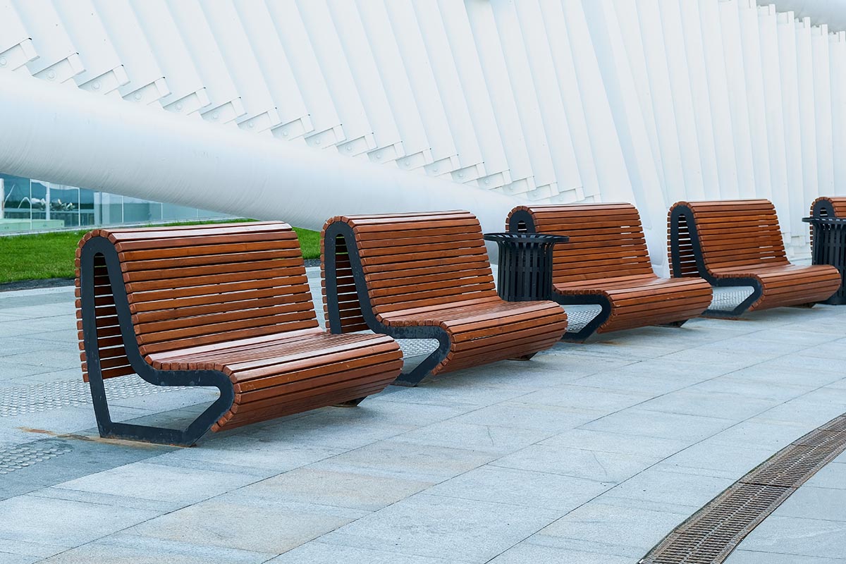 Recreation,Area,With,Empty,Contemporary,Wooden,Benches,Along,White,Curved